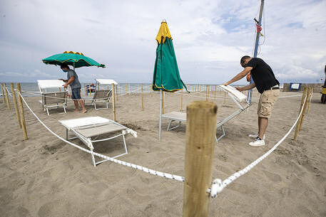 Umbrellas arranged in compliance with the rules on social distancing in a beach club in, in Fregene, a seaside resort located on the Tyrrhenian coast, about 30 kilometers from Rome, among the most renowned on the Lazio coast, during a gradual easing of lockdown restrictions introduced in response to the coronavirus disease (COVID-19) pandemic Rome, Italy, 29 May 2020. ANSA/MASSIMO PERCOSSI