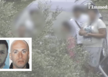 Bruno e Albanese; sullo sfondo, un'immagine tratta dal blitz