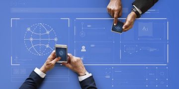 Business people syncing data by mobile phones